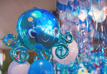 Fototapeta premium Festive decorated selling with blue tone helium balloons, birthday party
