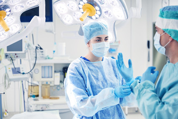 surgeons in operating room at hospital