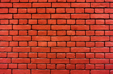 Ancient old red orange outdoor stone wall made with rectangle bricks old vintage retro background