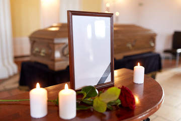 photo frame and coffin at funeral in church