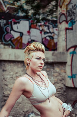 Naklejka premium Hot blonde with colored wall background