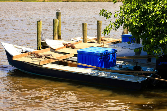 Oyster boats tied up along the Apalachicola Estuary in Florida leading to the Gulf of Mexico