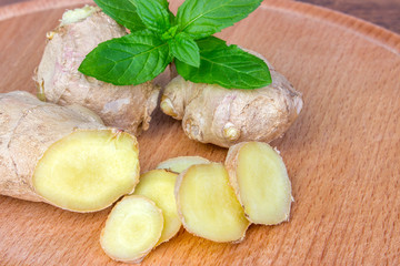 Ginger root with leaves of mint