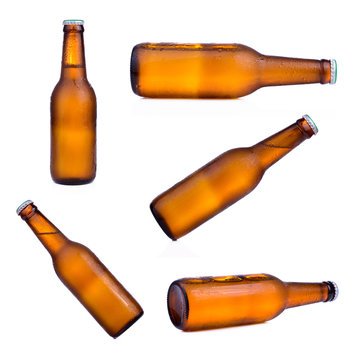 Bottle Of Beer With Drops Isolated On White Background