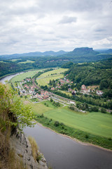 Fototapeta na wymiar Panorama view from rocks Bastei to river Elbe and Rathen, Saxon Switzerland, Germany