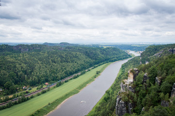 Fototapeta na wymiar Panorama view from rocks Bastei to river Elbe and Rathen, Saxon Switzerland, Germany