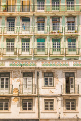 Obraz premium Typical colorful rusty facades wall on houses in Lisbon, Portugal 