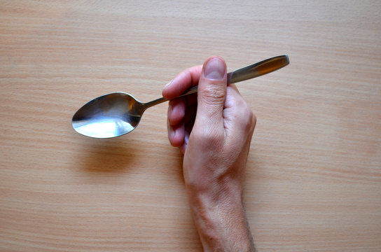 tablespoon in the right hand