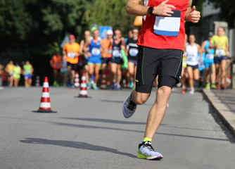 Fototapeta na wymiar runner runs the marathon on the city street