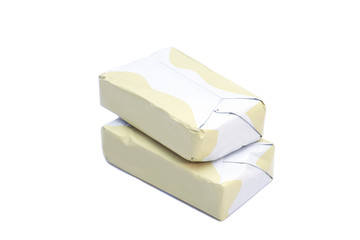 wrapped butter sticks isolated on white background