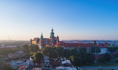 Krakow, Poland. Skyline panorama with historic royal Wawel castle and cathedral.  Aerial view in sunrise light