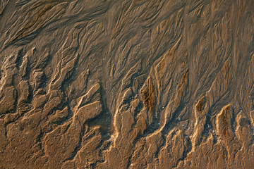 Fototapeta na wymiar Природный рисунок на морском песке.