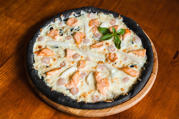 Delicious pizza with meat, cheese and mushrooms