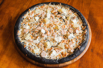 Delicious pizza with meat, cheese and mushrooms