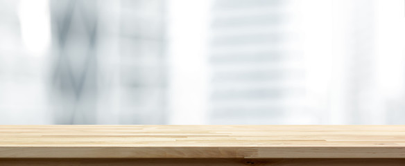 Wood table top on blur  city office building  background, panoramic banner