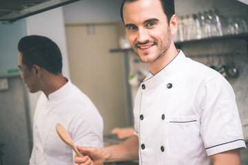 Fototapeta premium Chef preparing food in the kitchen of a restaurant 