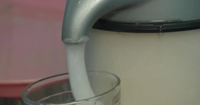 Woman make oxygen cocktail with device for oxygen scum. Oxygen cocktail for children. Woman make oxygen cocktail with device for oxy scum