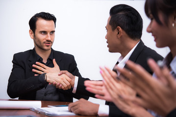 Business agreement a deal at meeting  