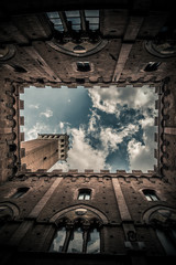 Tower of Mangia, Siena, Italy / Directly below view of Torre del Mangia, Piazza del Campo, Sienna, Italy