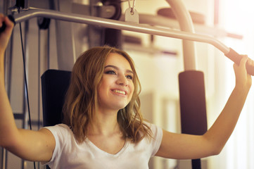 Fototapeta na wymiar young woman training in gym
