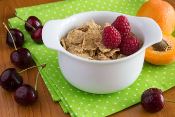 Healthy breakfast with flakes and fruits on the table