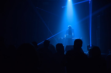 DJ in blue lightshow