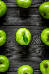Organic fruits with green apples pattern on dark background top view
