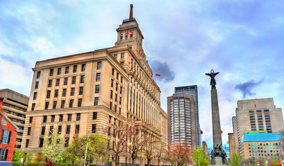 Fototapeta na wymiar The Canada Life building and the South African War Memorial on University Avenue in Toronto, Canada