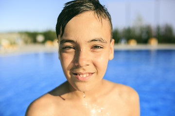 Boy  portrait in the swimming pool