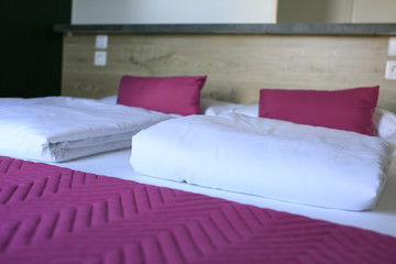 bed and pillow in a hotel