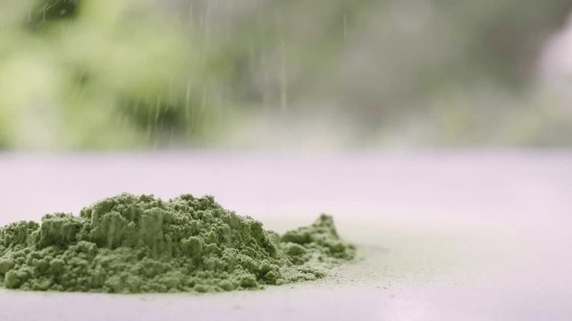 Eating barley grass.