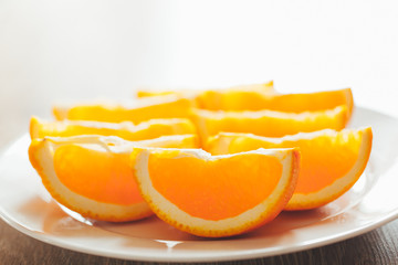 Naklejka na ściany i meble fresh orange slices on a plate