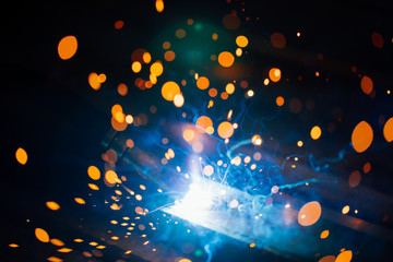 artistic welding sparks light, industrial background