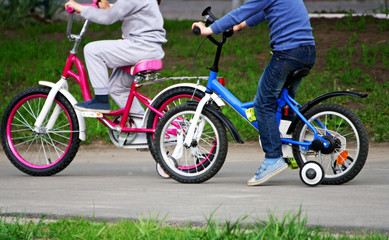 Children ride bicycles.
