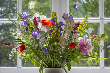 Beautiful bouquet consisting of meadows and garden flowers