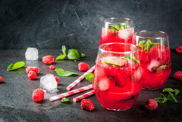 Summer refreshing non-alcoholic cocktails. Fruit drinks. Raspberry mojito lemonade with fresh...