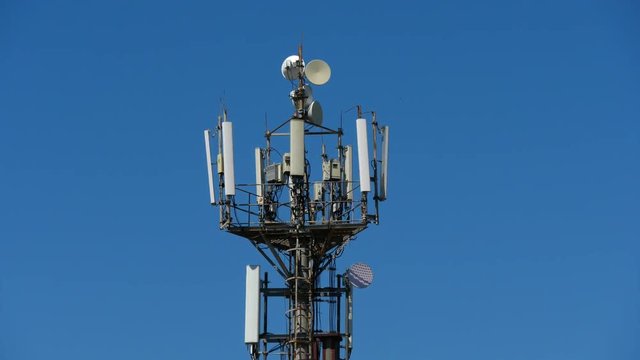 telecommunication cellular tower against blue sky