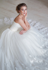 Fototapeta na wymiar portrait of beautiful blonde bride with fashion hairstyle and make-up
