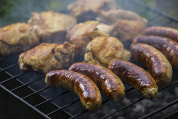 Assorted delicious grilled meat with vegetable over the coals on a barbecue