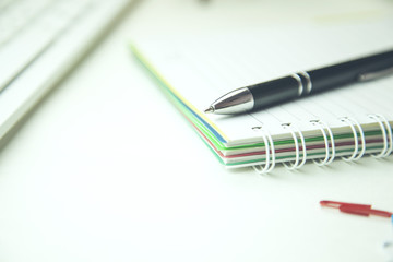 Fototapeta premium pen on open notepad