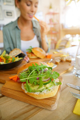 Closeup of veggie bagel set on restaurant table
