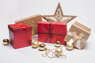 Holiday/Christmas gifts in red and gold with decor and star