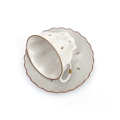Beautiful white porcelain tea cups on a white background