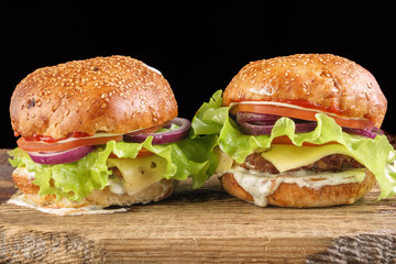 Homemade burgers on wooden. Close-up
