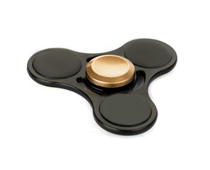 Black fidget spinner stress relieving toy isolated on white background