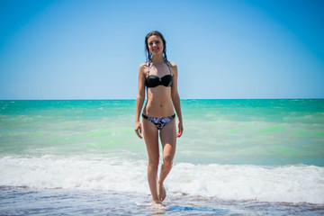 Girl on beach in swimsuit