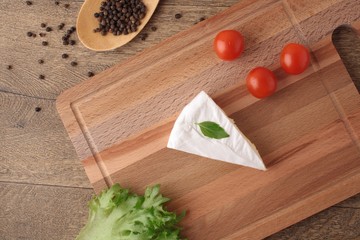 Camembert with salad and cherry