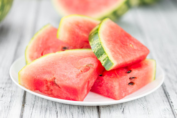 Portion of Fresh Watermelon on wooden background (selective focus).