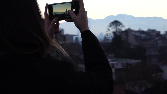 Girl Taking Picture of Santiago city at the Morning, Chile