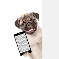 Dog with smartphone peeking behind white banner. isolated on white background